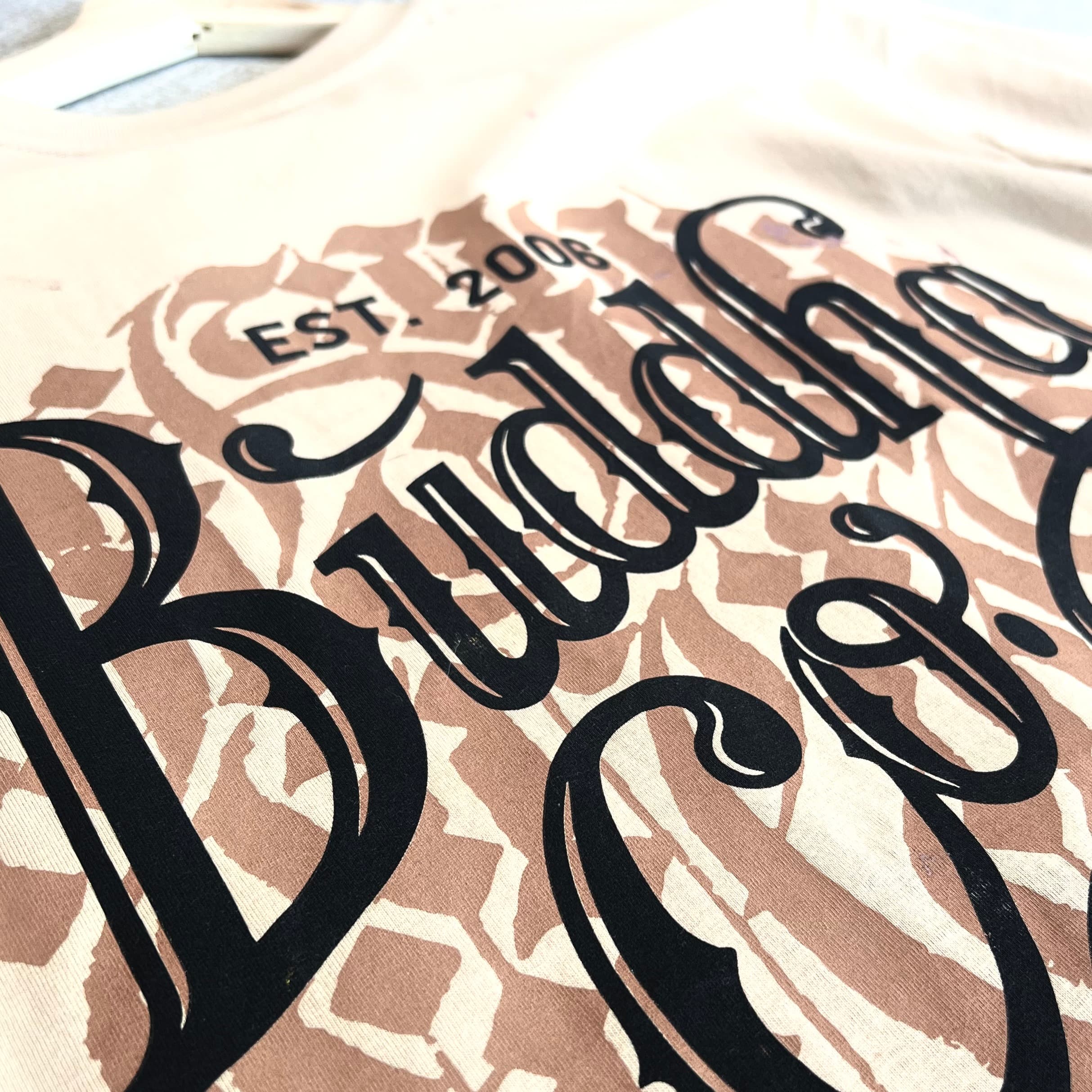 Finished screen printed apparel stacked for quality control