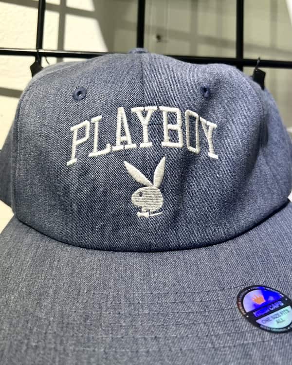 Arched lettering with fine-detail bunny embroidery on a vintage-wash cap