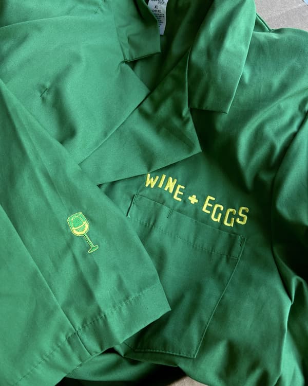 Chest and sleeve embroidery on kelly green camp-collar work shirts