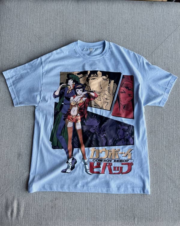 Full-front comic panel print on a light blue oversized tee