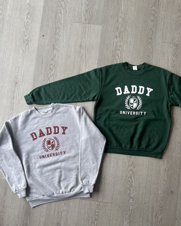 Collegiate crest prints on heather gray and forest green crewnecks