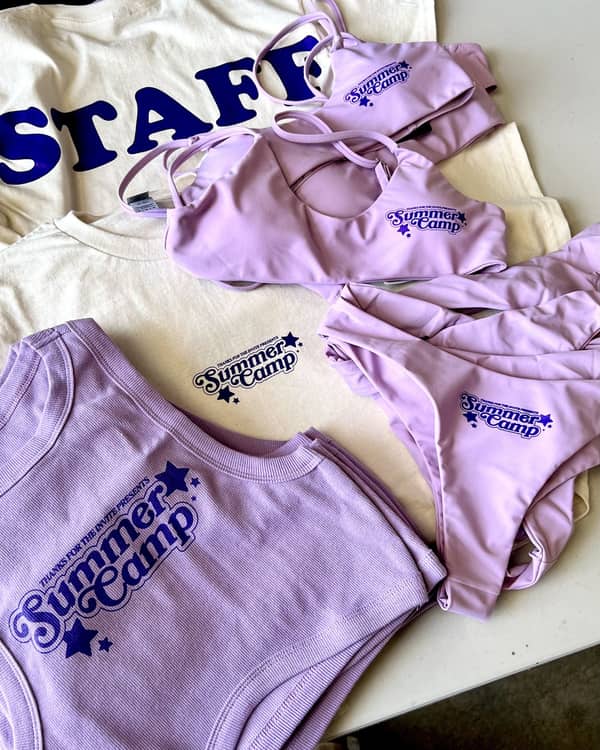 Coordinated swim sets, tanks, and staff tees printed for a summer camp